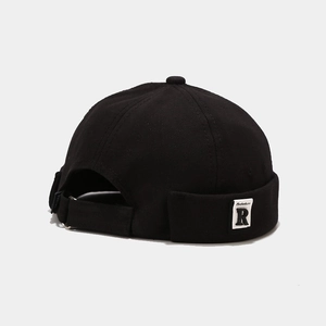 Detail of adjustable strap and metal buckle on black cotton Miki Hat with R-label