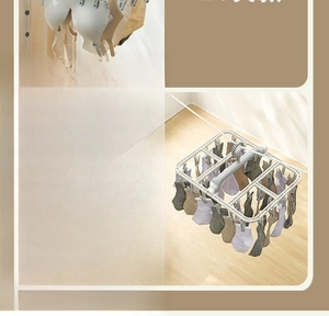 Detail view of foldable drying rack with 32 clips for socks and underwear storage