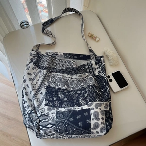 Bohemian large capacity crossbody cotton bag with monochrome paisley patterns and wide strap