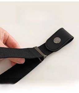 Detail showing the strong elastic stretch and adjustable metal buckle of the black waist belt