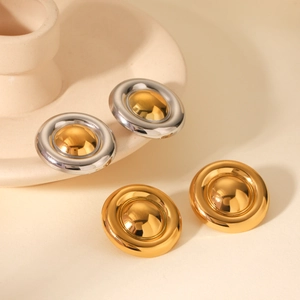 Detailed close-up of 18K gold-plated circular stud earrings with mirror finish and simple geometric design