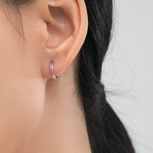 S925 sterling silver hoop earrings with pink rectangular zircon stones worn by a model