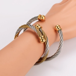 Set of two stainless steel twisted cable wire cuff bracelets with spherical bead ends