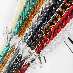 Close-up of colorful acrylic chunky chains with metallic spring buckles in various shades