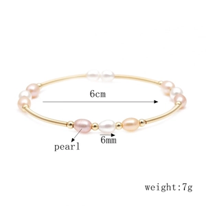Detailed specs of gold wire cuff bracelet with white and pink pearls showing 6cm diameter