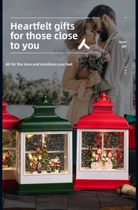 Close-up of vintage Christmas snow globe lanterns with glowing LED trees and glitter