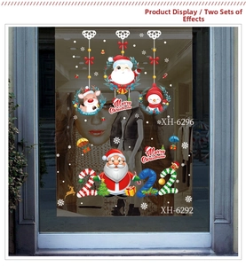 Detailed shop window view of Merry Christmas Santa Claus and reindeer glass stickers