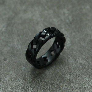 Detail of a black Cuban link chain ring for men made of durable stainless steel