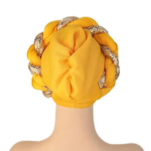 Detailed back view of a yellow African turban with gold and silver sequin braid detail
