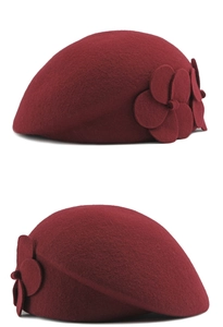 Close-up of a burgundy wool beret featuring elegant 3D flower detail and soft felt texture