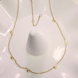 Golden titanium steel heart pendant necklace with laser-etched texture for women