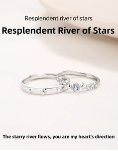 Macro detail of S925 sterling silver couple rings showing star patterns and crystal inlay
