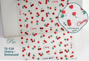 Vue détaillée d'autocollants 3D gaufrés pour ongles avec motifs cerises et relief