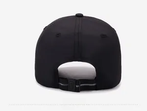 Detailed back view of black baseball cap featuring adjustable buckle strap and reflective strip