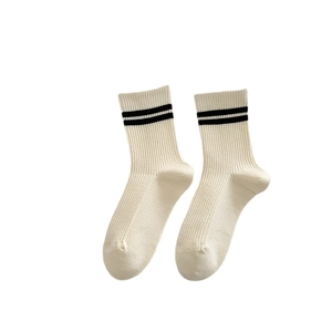Beige mid-calf wool socks featuring black striped cuffs on a clean white background