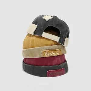 Three retro cotton Miki hats for kids in black, mustard yellow and burgundy colors