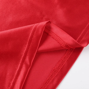Detail view showing double-needle stitching and seam texture on red satin dress