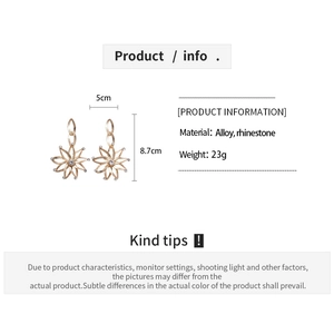 Macro detail of champagne gold floral chain earrings with rhinestones and dimensions