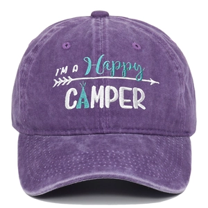 Detailed view of Happy Camper embroidery on purple washed cotton baseball cap texture