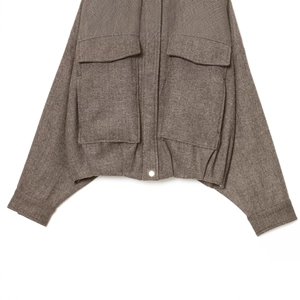 Deep grey herringbone bomber jacket featuring textured wool blend and dual flap pockets