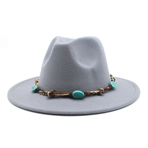 Detail of grey fedora with ethnic band featuring turquoise beads and metal chain