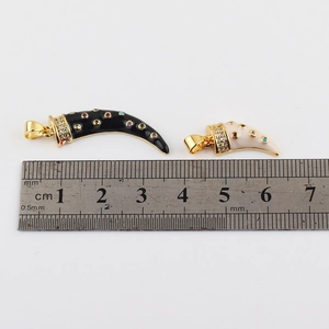 Fashion horn pendants in black and ivory with zircon inlay and measurement ruler