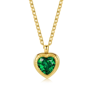 Minimalist gold necklace featuring a heart-shaped emerald zircon pendant on white background