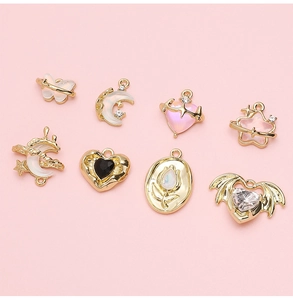 Macro view of gold-rimmed alloy pendants with glass insets for DIY jewelry making