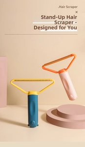 Manual hair scraper tool with colorful cartoon handle and metal head for fabric care