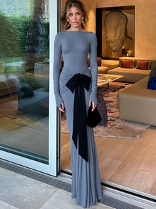 Elegant grey long sleeve maxi dress featuring a large black waist bow and ruched detailing