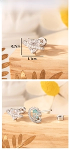Macro detail of heart-shaped star earrings with cubic zirconia and silver finish