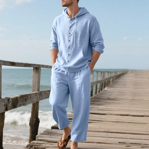 Men's light blue linen beach set featuring a hooded long-sleeve shirt and matching trousers