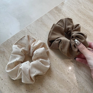 Elegant knit scrunchie set in cream and caramel colors featuring sparkling rhinestones