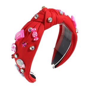 Red fabric knotted headband with sweet candy charms, pink bows and colorful rhinestones