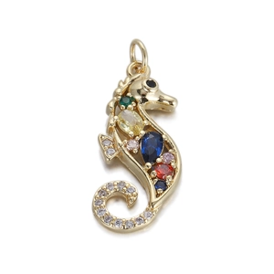 Detailed macro shot of golden seahorse pendant with colorful crystals and rhinestones