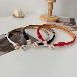Elegant thin leather waist belts for women with pearl buckle detail in white, black and red