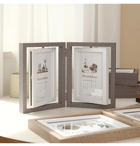 Detail of creative double-sided rotating wooden photo frame showing 6-inch calendar insert