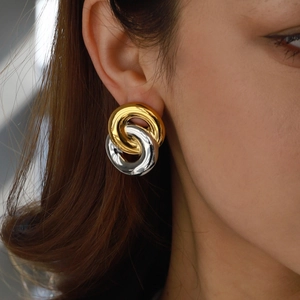 Two-tone intertwined titanium steel earrings featuring a polished gold and silver mirror finish