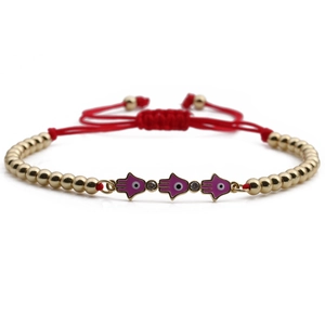 Pink Hamsa Hand Evil Eye beaded bracelet with red braided cord and gold-plated copper beads