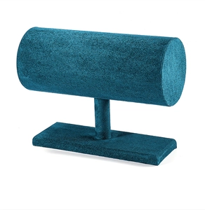 Detail view of teal velvet T-bar jewelry display stand with a stable rectangular base