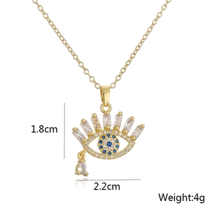 Detail view of 18K gold plated eye pendant with blue and white zircon teardrop