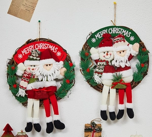 Detail of Christmas rattan wreaths featuring Santa and Snowman with Merry Christmas banners