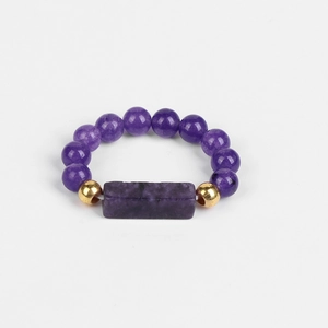 Detail showing 4mm purple bloodstone beads and rectangle stone on an elastic ring
