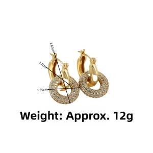 Detailed view of luxury gold hoop earrings with full pavé cubic zirconia setting