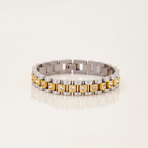 Macro view of two-tone stainless steel bracelet with hand-set cubic zirconia crystals