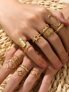Detailed view of 18k gold plated fashion rings featuring celestial star and moon patterns