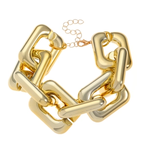 Detailed view of the chunky gold-tone chain necklace with lobster clasp and extender