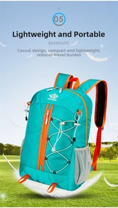 Detail of light nylon outdoor backpack in bright blue with orange accents and bungee cords