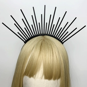 Detailed view of a black sunburst crown headband with radial zip ties on a mannequin