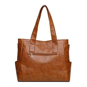Brown leather tote bag for women with large capacity and vintage texture on white background